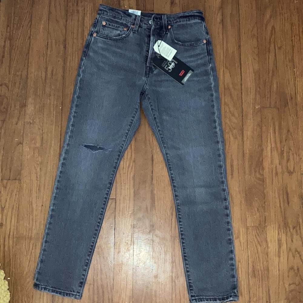 Distressed black Levi’s skinny jeans.